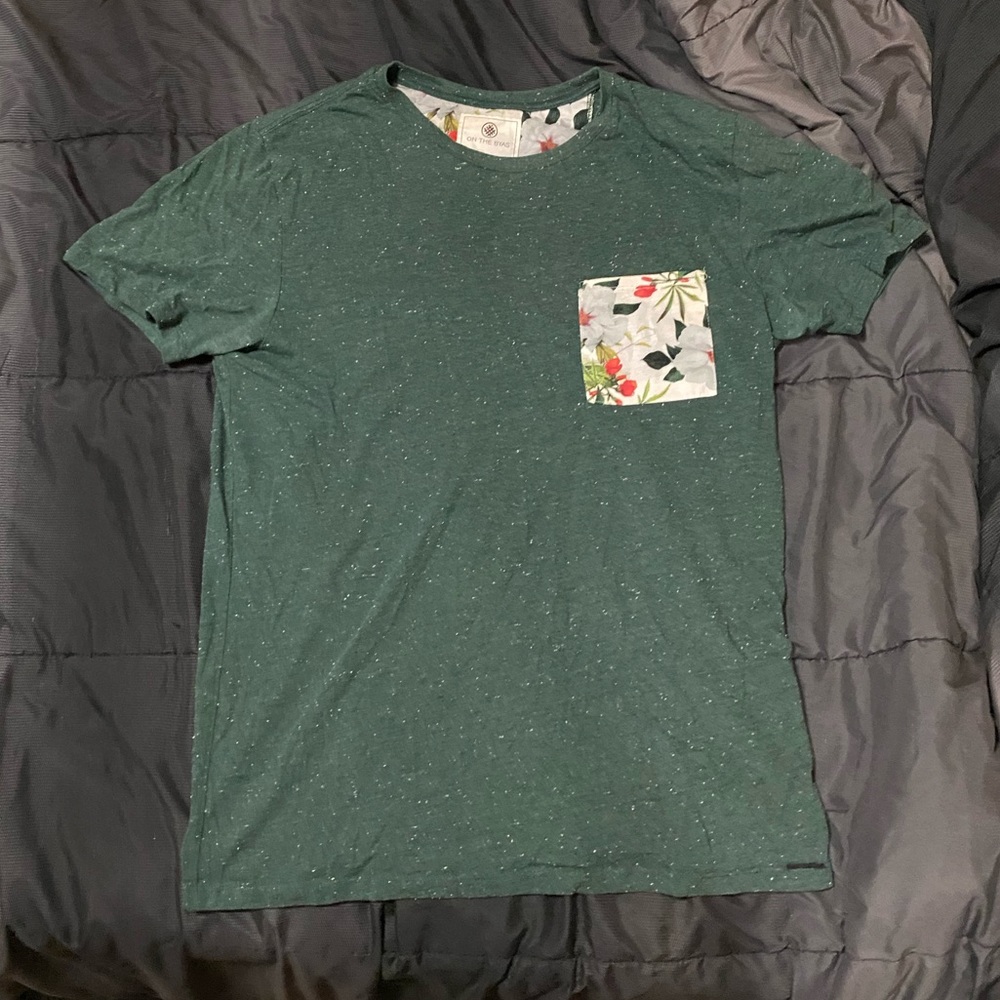 On the Byas. Floral and Green shirt